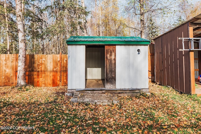 view of shed featuring a fenced backyard