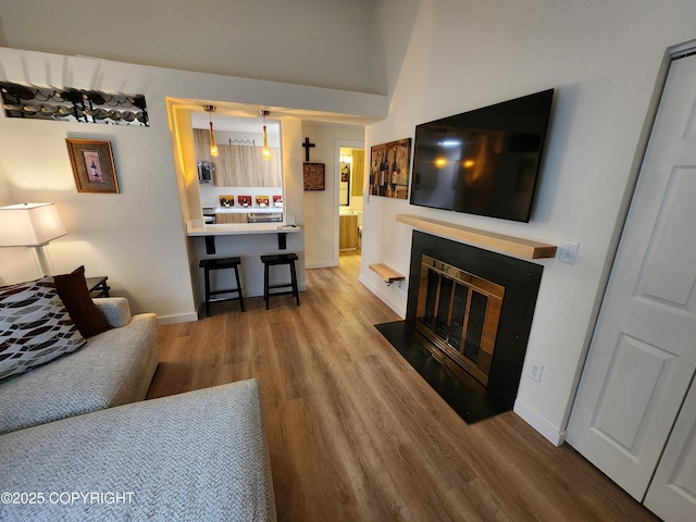 4342 Reka Dr, Anchorage, AK 99508 - living area with wood finished floors and a fireplace with flush hearth