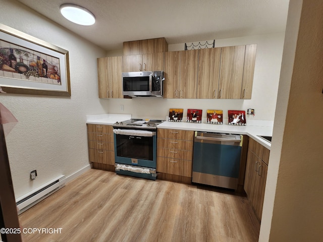 4342 Reka Dr, Anchorage, AK 99508 - kitchen featuring stainless steel appliances, a baseboard radiator, light wood-style floors, light countertops, and a textured wall