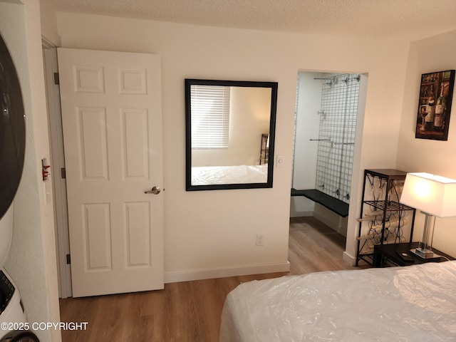 4342 Reka Dr, Anchorage, AK 99508 - bedroom featuring wood finished floors and baseboards
