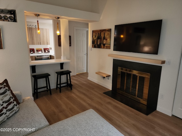 4342 Reka Dr, Anchorage, AK 99508 - living room featuring wood finished floors and a fireplace with flush hearth