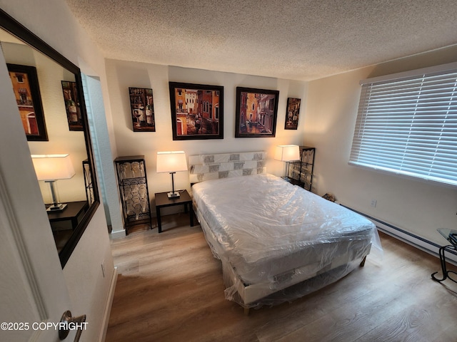 4342 Reka Dr, Anchorage, AK 99508 - bedroom with wood finished floors, a textured ceiling, and pool table