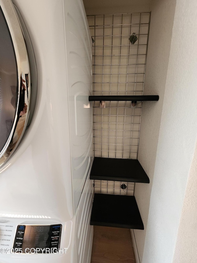 4342 Reka Dr, Anchorage, AK 99508 - bathroom with wood finished floors, washer / clothes dryer, and a textured wall