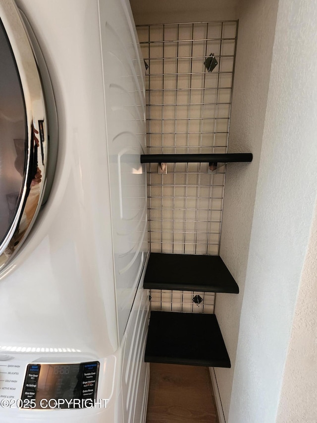 4342 Reka Dr, Anchorage, AK 99508 - detailed view of washer / dryer, wood finished floors, and a textured wall