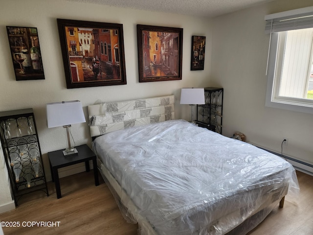 4342 Reka Dr, Anchorage, AK 99508 - bedroom with wood finished floors and baseboards