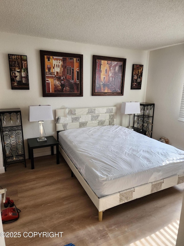 4342 Reka Dr, Anchorage, AK 99508 - bedroom with wood finished floors and a textured ceiling