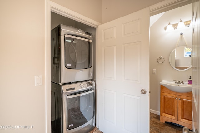 laundry room with stacked washer and dryer and sink