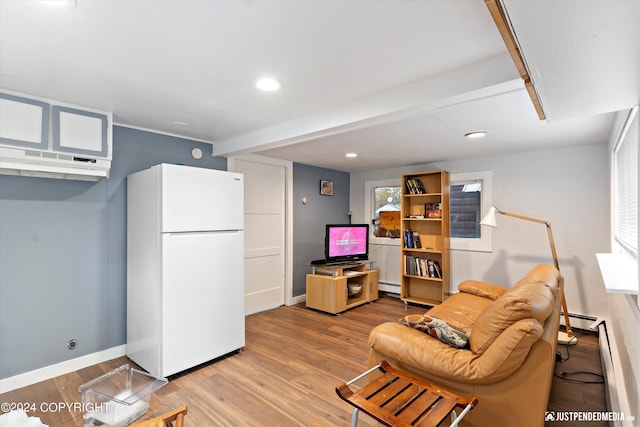 1324 Latouche St, Anchorage, AK 99501 - living room featuring a baseboard heating unit, light wood-type flooring, baseboards, and recessed lighting