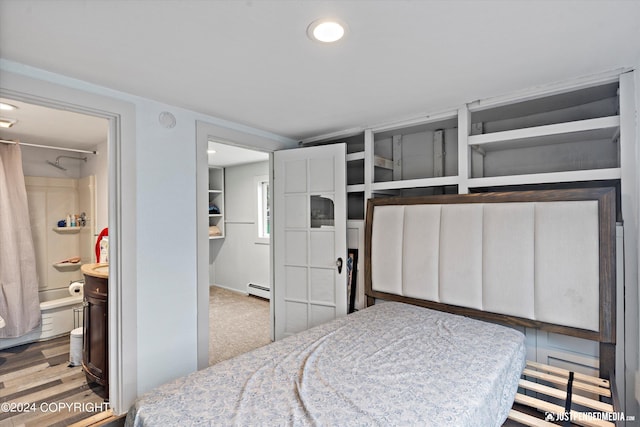 1324 Latouche St, Anchorage, AK 99501 - bedroom featuring a baseboard radiator, connected bathroom, recessed lighting, and wood finished floors