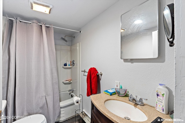 full bathroom featuring vanity, shower / tub combo, and toilet