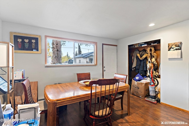 dining space with dark hardwood / wood-style flooring