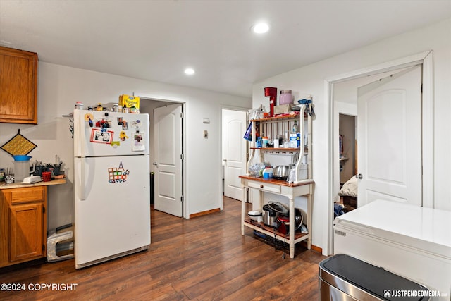 kitchen featuring white fridge and dark hardwood / wood-style flooring