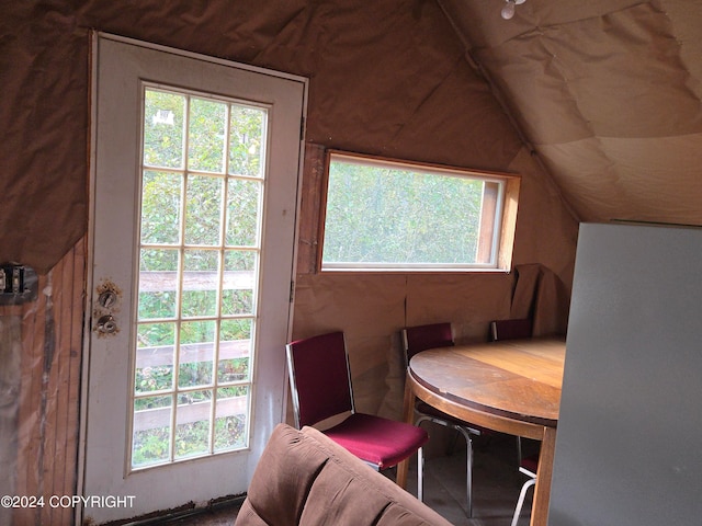 dining room featuring vaulted ceiling