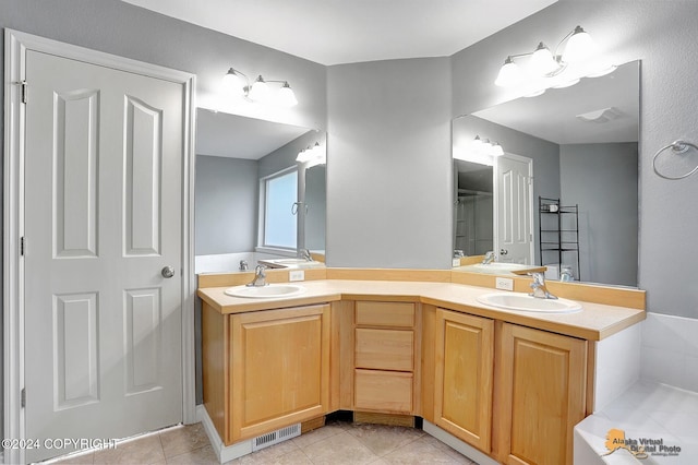 bathroom with vanity and tile patterned floors