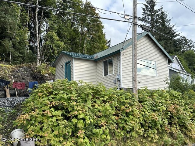 view of home's exterior featuring metal roof