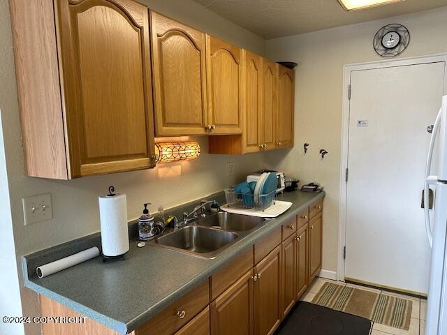 kitchen with white refrigerator and sink