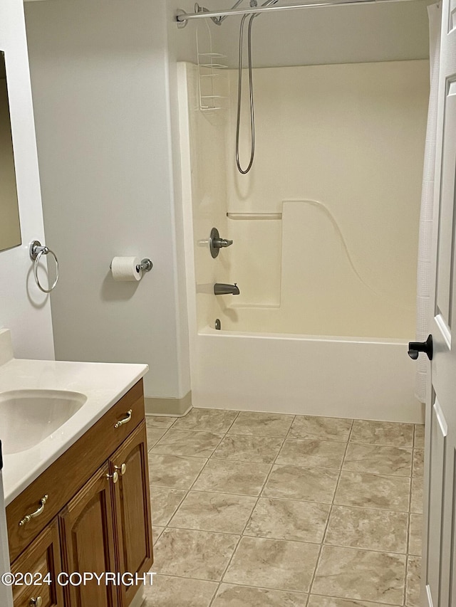 41385 Ptarmigan Heights Dr, Homer, AK 99603 - bathroom with vanity, bathing tub / shower combination, and baseboards