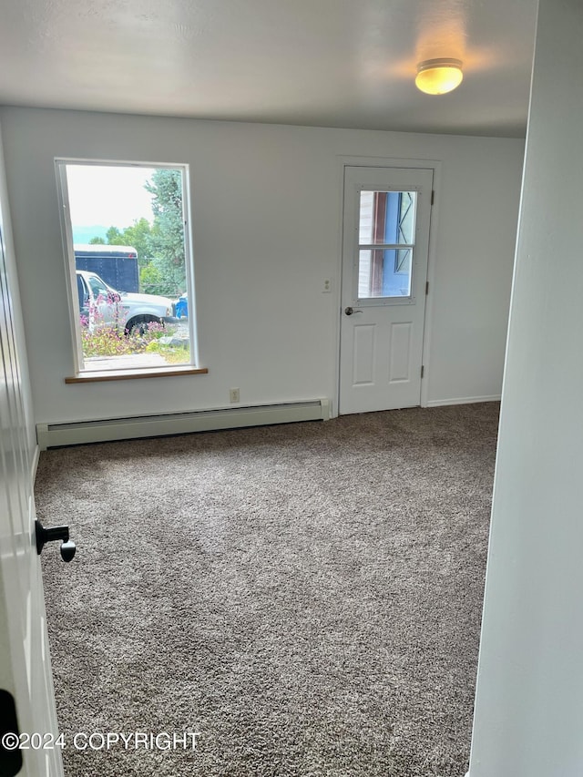 41385 Ptarmigan Heights Dr, Homer, AK 99603 - carpeted foyer entrance with a baseboard radiator and baseboards