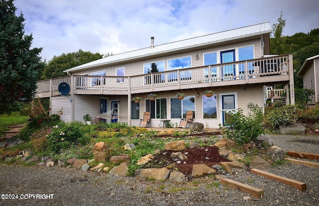 41385 Ptarmigan Heights Dr, Homer, AK 99603 - rear view of house featuring metal roof and a deck