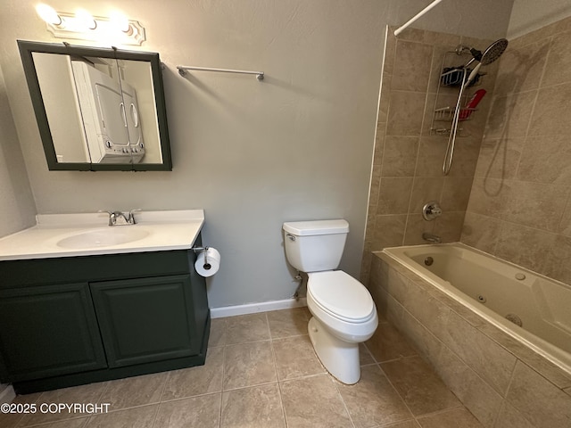 full bathroom with tile patterned flooring, toilet, vanity, and tiled shower / bath