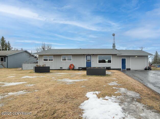 view of front of property with a garage and aphalt driveway