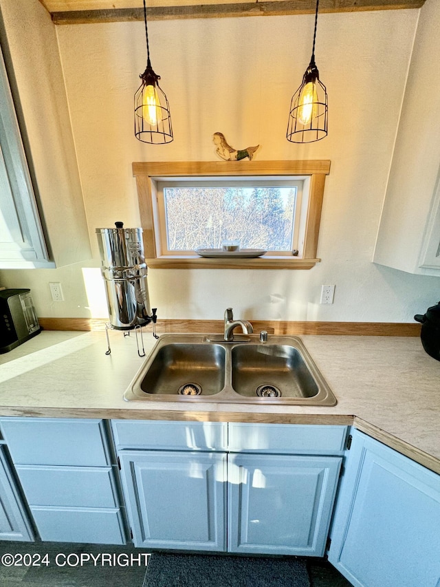 40854 Ruth Way, Homer, AK 99603 - kitchen featuring light countertops, a sink, and pendant lighting