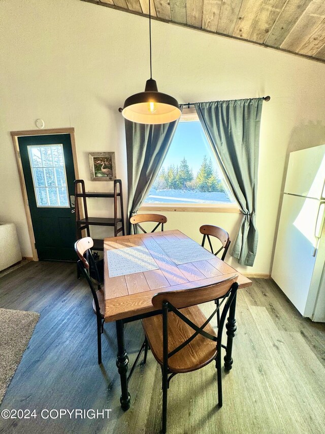 dining area featuring wood ceiling and hardwood / wood-style floors