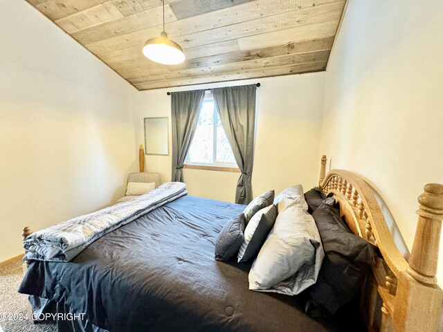 bedroom with lofted ceiling and wood ceiling