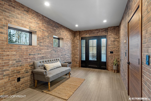 entryway with brick wall