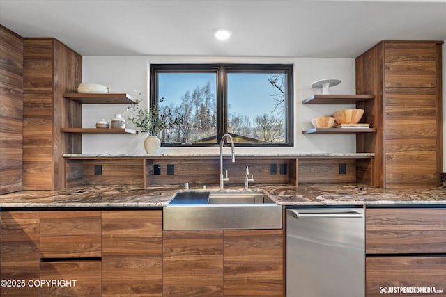 kitchen featuring dark stone countertops and sink