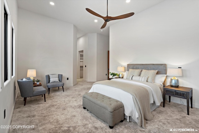 bedroom featuring ceiling fan and light carpet