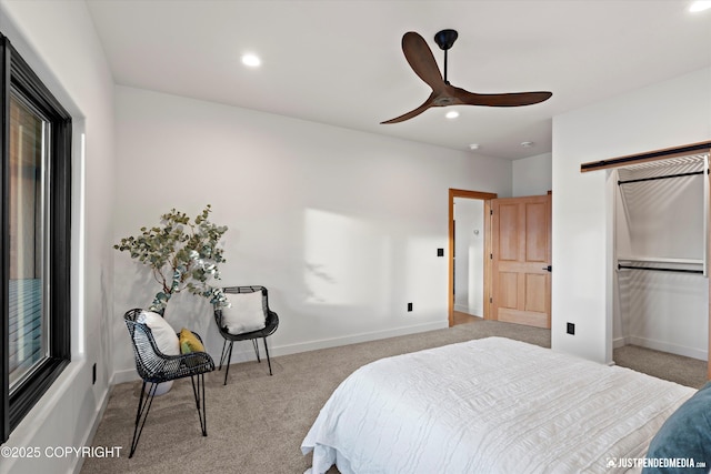 bedroom featuring ceiling fan and light colored carpet