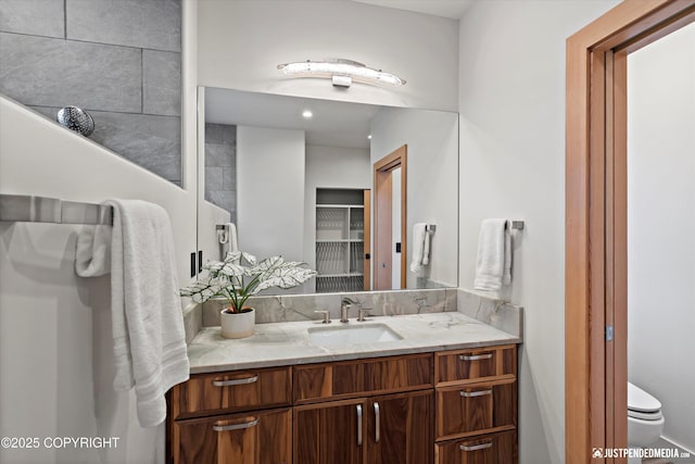 bathroom with vanity and toilet