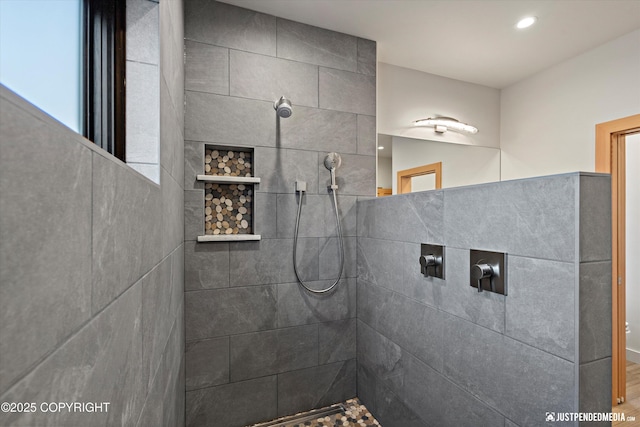 bathroom featuring tiled shower