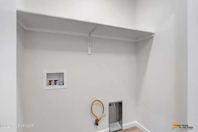 laundry room featuring hookup for a washing machine and hardwood / wood-style floors