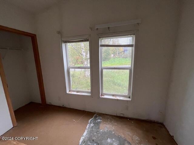 unfurnished bedroom with a closet