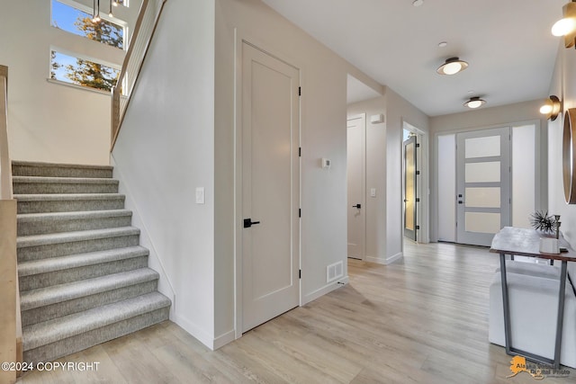 entryway with light hardwood / wood-style floors