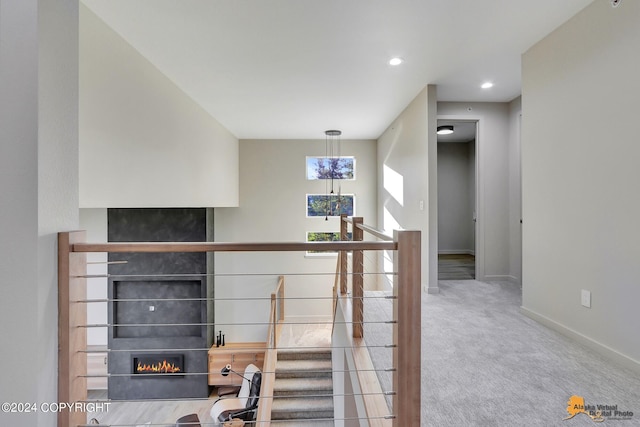 interior space with carpet and a large fireplace