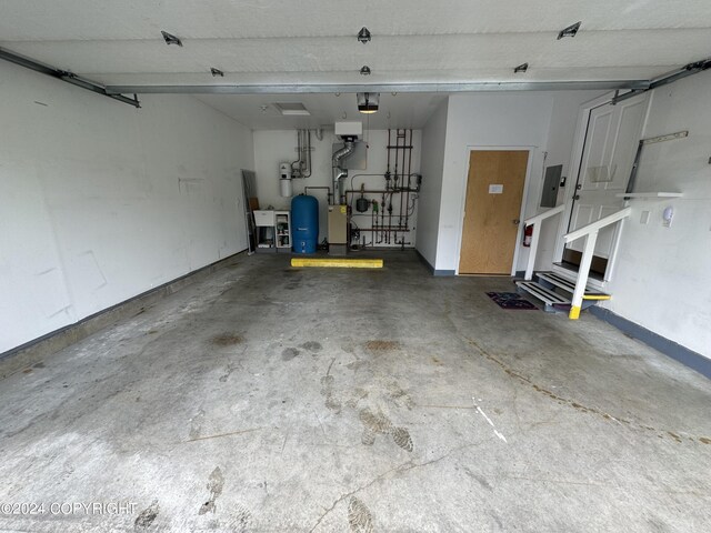 garage with electric panel and sink