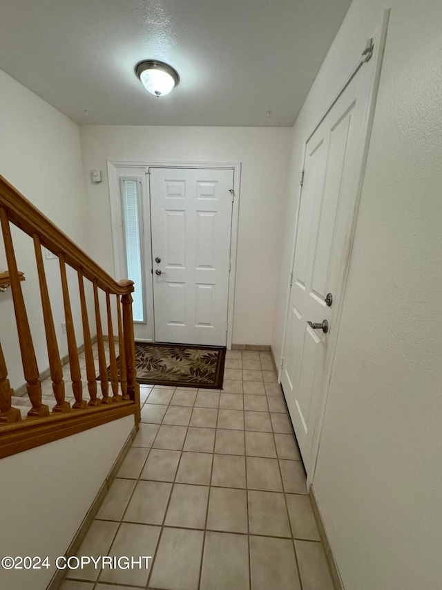 entrance foyer featuring light tile patterned floors