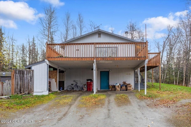 back of property featuring a deck