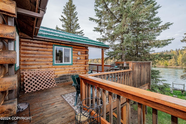 wooden deck with a water view