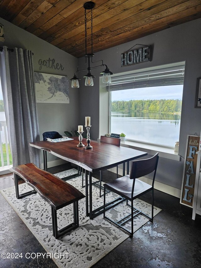 dining area featuring wood ceiling, a water view, and vaulted ceiling