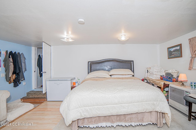 bedroom featuring light hardwood / wood-style flooring