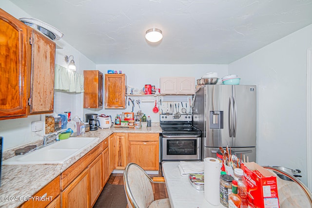 kitchen with appliances with stainless steel finishes and sink