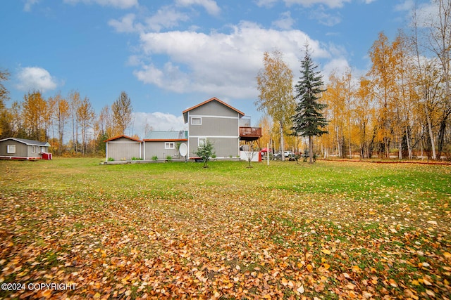 view of yard with a wooden deck