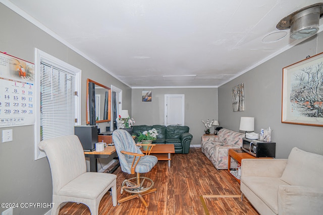 living room with ornamental molding and dark hardwood / wood-style flooring