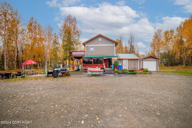 view of front of property with a porch and a garage