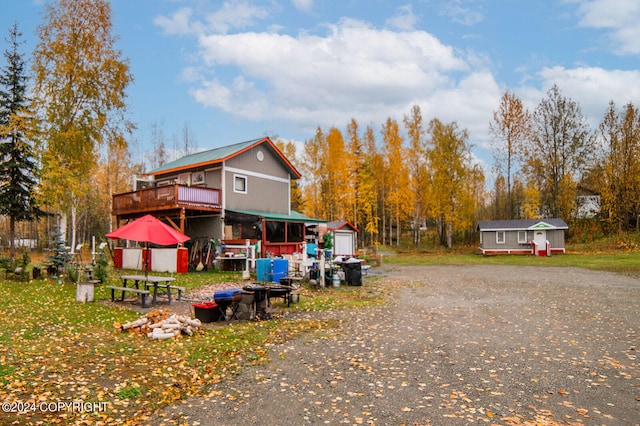 exterior space with a storage shed and a deck