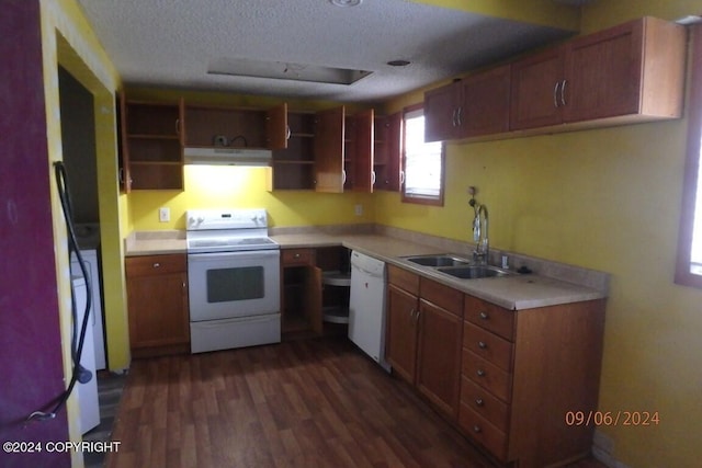 kitchen with a textured ceiling, white appliances, sink, and dark wood-type flooring